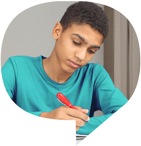 A young boy writing