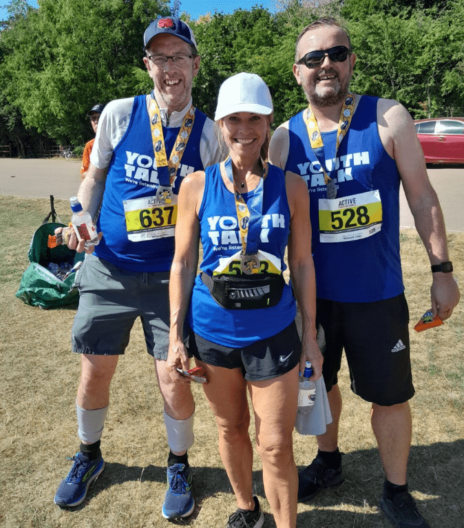 Members of the Platinum Point Team - Mark Fellows, Caroline Deutsche and David Buckley - posing with their medals after completing the St Albans 10k.